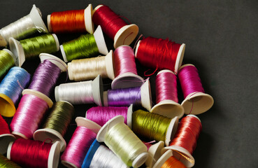 close-up colorful threads,craft threads,colorful lace knitting threads wound on spools,