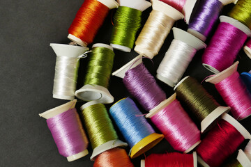 close-up colorful threads,craft threads,colorful lace knitting threads wound on spools,