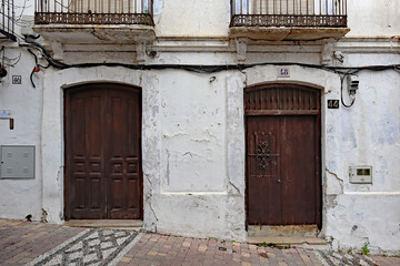 Two old wooden door in the backstreets of the Spanish town of Estepona on the Costa del Sol