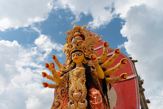 Howrah, West Bengal, India- 8th October 2019 : Vijayadashami, Goddess durga idol is being prepared for immersion. Blue sky and white clouds background.
