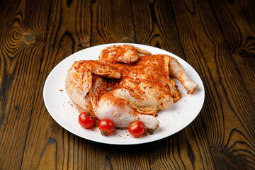 meat products on a white plate on a wooden table
