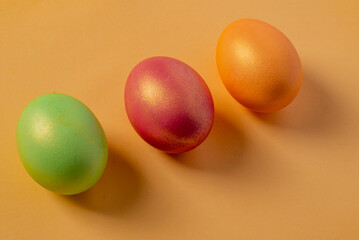 colored painted eggs on a yellow background. High quality photo