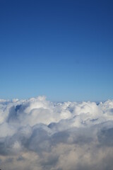 Aerial heaven scene from fluffy white cumulus clouds in the sky for the feeling of freedom 