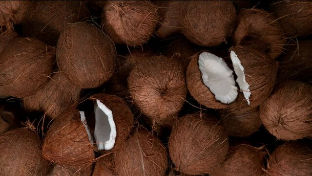 Cracked coconuts falling, super slow motion filmed on high speed cinematic camera at 1000 fps.