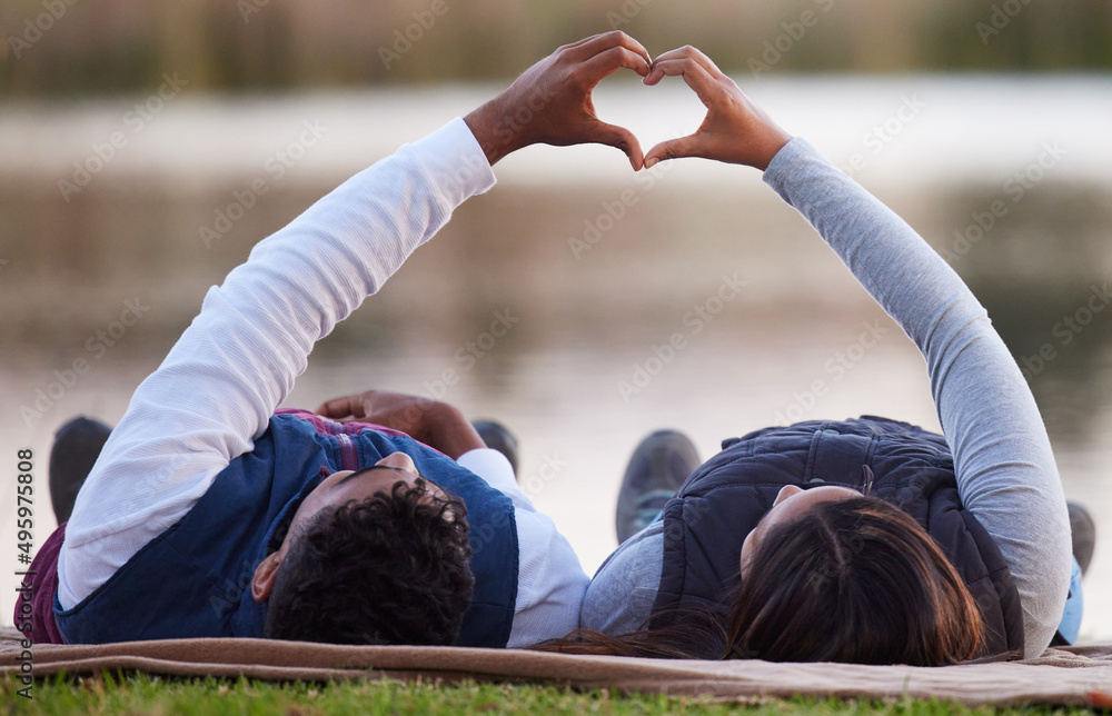 Aufkleber My heart is complete with you. Shot of a couple creating a heart shape with their hands during a camping trip.