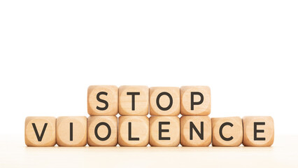 Stop violence phrase on wooden blocks. Copy space. White background