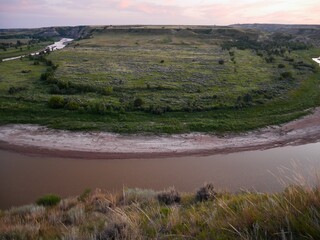 Little Missouri River seen from Riverbend Overlook at sunset. Theodore Roosevelt National Park, North Dakota, USA.