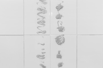 Cement stains on white spots wall tiles or floor old texture concrete effect sample background