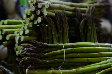A bunch of asparagus. Fresh asparagus on a market stall, hoots at retail market display, at the local food market