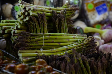 A bunch of asparagus. Fresh asparagus on a market stall, hoots at retail market display, at the local food market