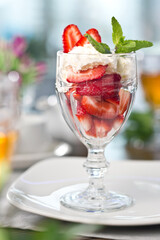 Sweets cake cream with strawberries. Photo of food on a white background