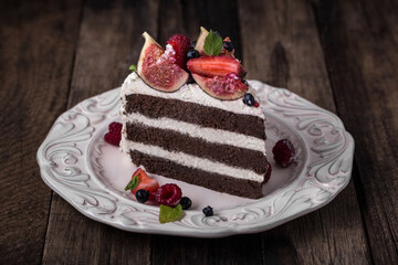 Sweets pastry chocolate cake with figs. Photo of food on a white background