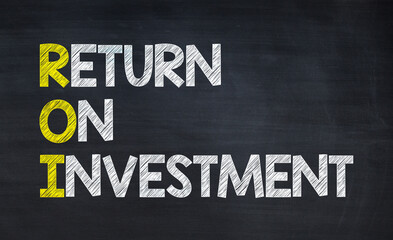 Return on investment - ROI  acronym written on chalkboard, business acronyms.
