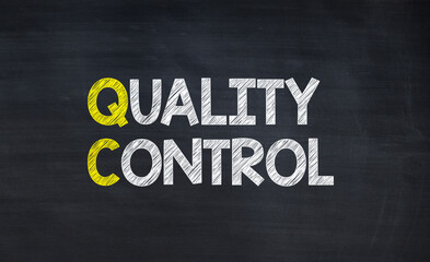 Fototapeta premium Quality control - acronym written on chalkboard, business acronyms.