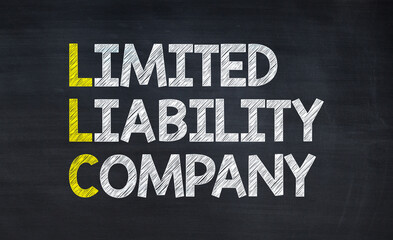 Limited liability company - LLC acronym written on chalkboard, business acronyms.