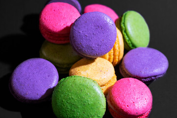 lot of colorful pasta with French cookies. Delicious almond macaron.