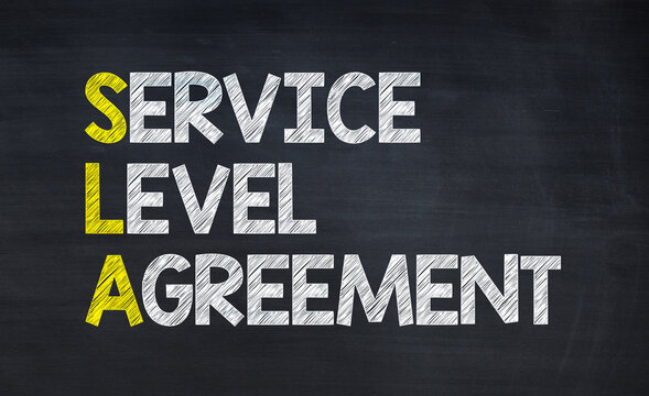 Service level agreement - SLA acronym written on chalkboard, business acronyms.