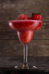 Alcoholic drink strawberry. Photo of a drink on a dark background