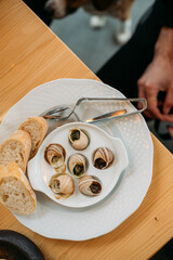 french snail dish with a glass of wine