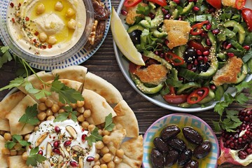 Traditional Lebanese dishes assortment. Chickpea Fatteh, Tabbouleh, Fattoush Salad, Hummus and...