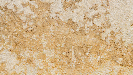 Old marble texture for background. Beige stone texture with spots and cracks