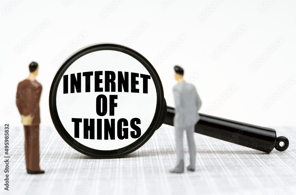 Poster On the reports there are figures of people and a magnifying glass with the inscription - Internet of things