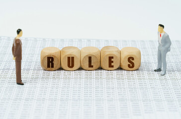 On financial reports there are figures of people and cubes with the inscription - RULES