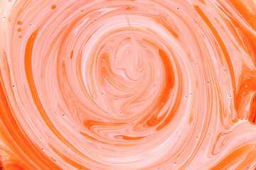 Close up abstract mixing of orange and white paint, background texture