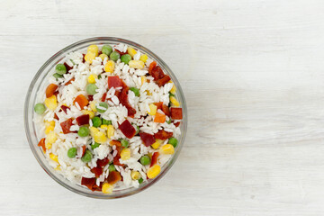 Frozen mixture of rice and vegetables, food background, close-up