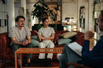 Husband listens as wife shares during counseling session