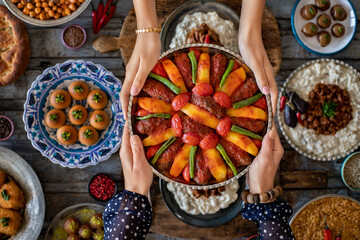 Many kinds of food at the hands of family members