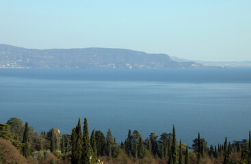 Obraz premium panorama of Lake Garda with the mountains reaching the shore in northern Italy
