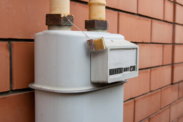 gas meter on the wall of the house