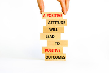 Think positive symbol. Wood blocks with words A positive attitude will come to positive outcomes. Beautiful white background copy space. Businessman hand. Business motivational think positive concept.