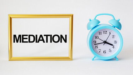 intermediary word - isolated text in golden frame and white background with clock