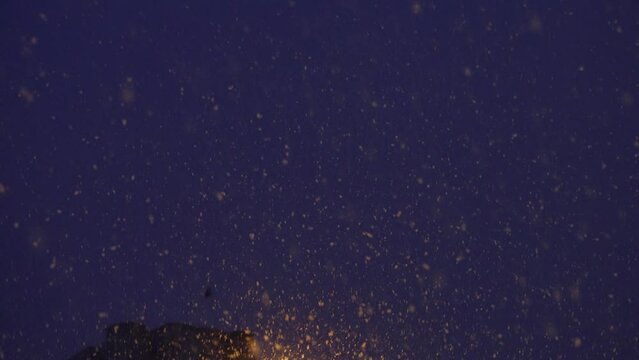 Night time snow concept. Snowflakes, snowfall on winter time. Rain storm, wind and dark night.