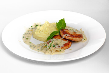 Cutlets with onion sauce and mashed potatoes