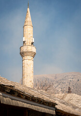 Stone tiled roofs and minaret in the city of Mostar, Bosnia & Herzegovina