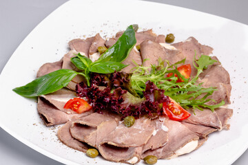 Vitello tonato is a traditional Italian dish of veal with tuna sauce