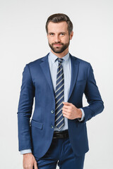 Vertical portrait of handsome caucasian man in formal suit looking at camera isolated in white background. Confident businessman ceo boss freelancer manager