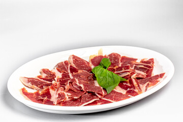 Ham sliced with parmesan, lime and arugula