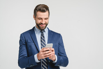 Caucasian young businessman ceo bank worker employee freelancer financial adviser in formalwear using smart phone cellphone for online mobile applications, calls isolated in white