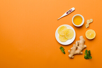 Natural cold and flu home remedies and thermometer. Natural ingredients for immunity stimulation and viruses protection. top view flat lay
