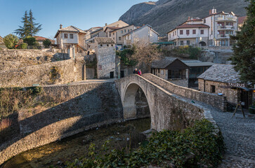 Fototapeta premium The Crooked Bridge over the creek in the city of Mostar, Bosnia & Herzegovina