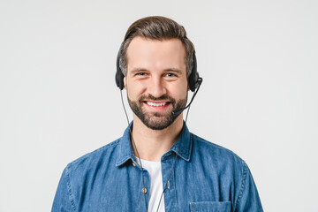 Closeup photo of caucasian male young hotline it support worker in headphones assisting clients...