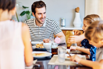 Theyre thoroughly enjoying their meal together. Shot of a family having breakfast together at home.