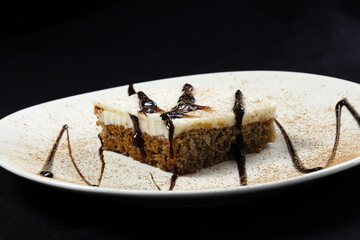 Cyprus Dessert on a white plate with black background.Also known as Kibris Tatlisi.