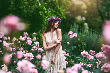 Where she feels most alive. Shot of a beautiful young woman wearing a floral head wreath posing in...