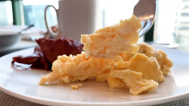 Closeup shot of Eating Scrambled Eggs
