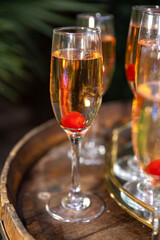 Non-alcoholic drinks served with a cherry inside the clear class